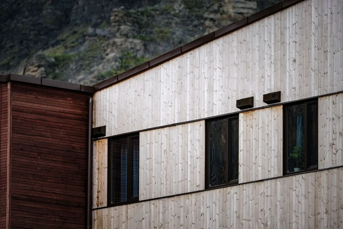 Close view of a building clad in pale timber boards